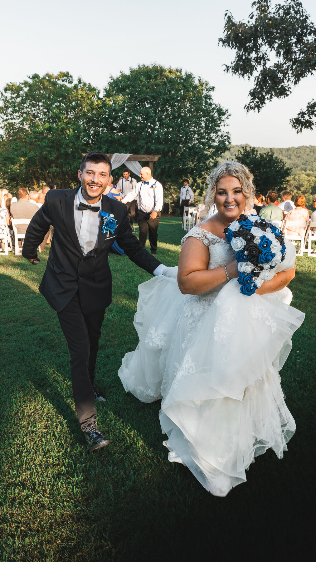 Newlyweds smiling during their recessional after a Tennessee wedding ceremony